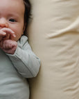 newborn baby on snuggle me organic infant lounger cover only honey