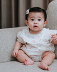 baby elsie wearing purebaby organic rosebud bodysuit special occasion organic cotton clothes