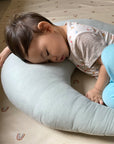 baby sleeping on snuggle me organic feeding support nursing pillow in slate