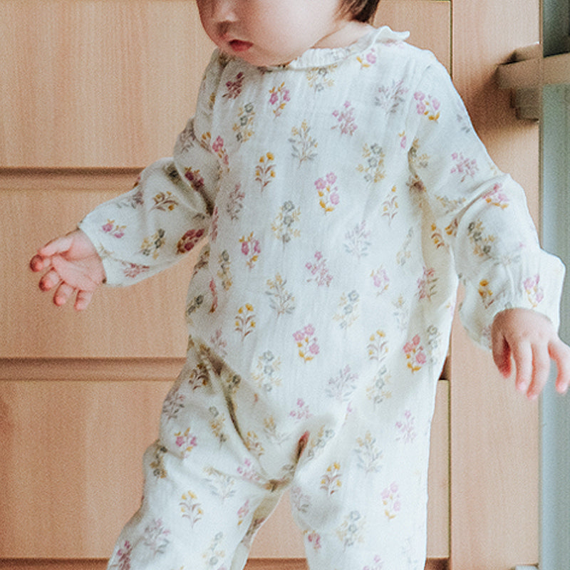 baby girl in purebaby posie floral growsuit organic cotton baby clothes