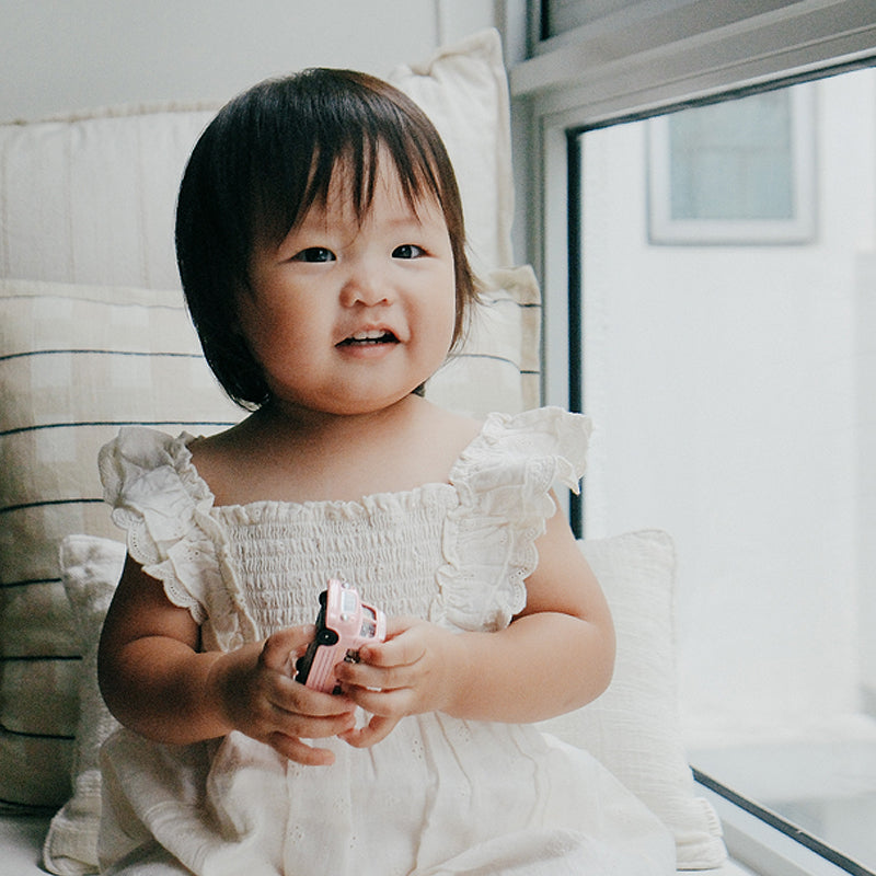 baby in purebaby smocked dress organic cotton baby clothes