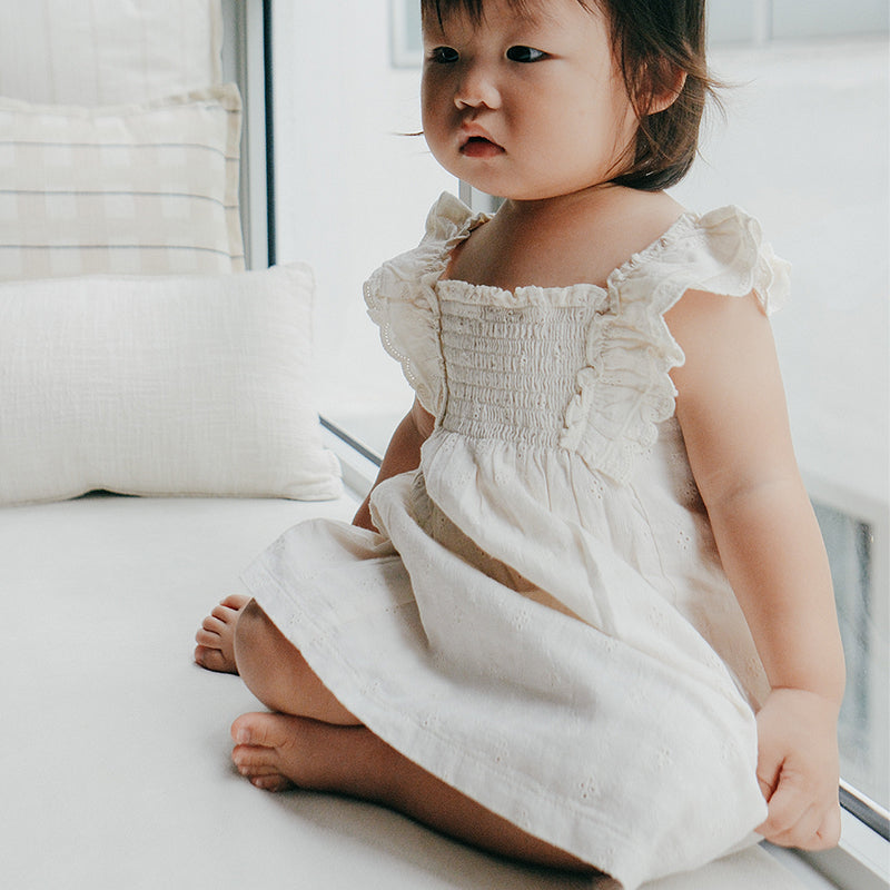 baby in purebaby smocked dress organic cotton baby clothes