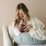 newborn baby breastfeeding on snuggle me organic feeding support nursing pillow in slate