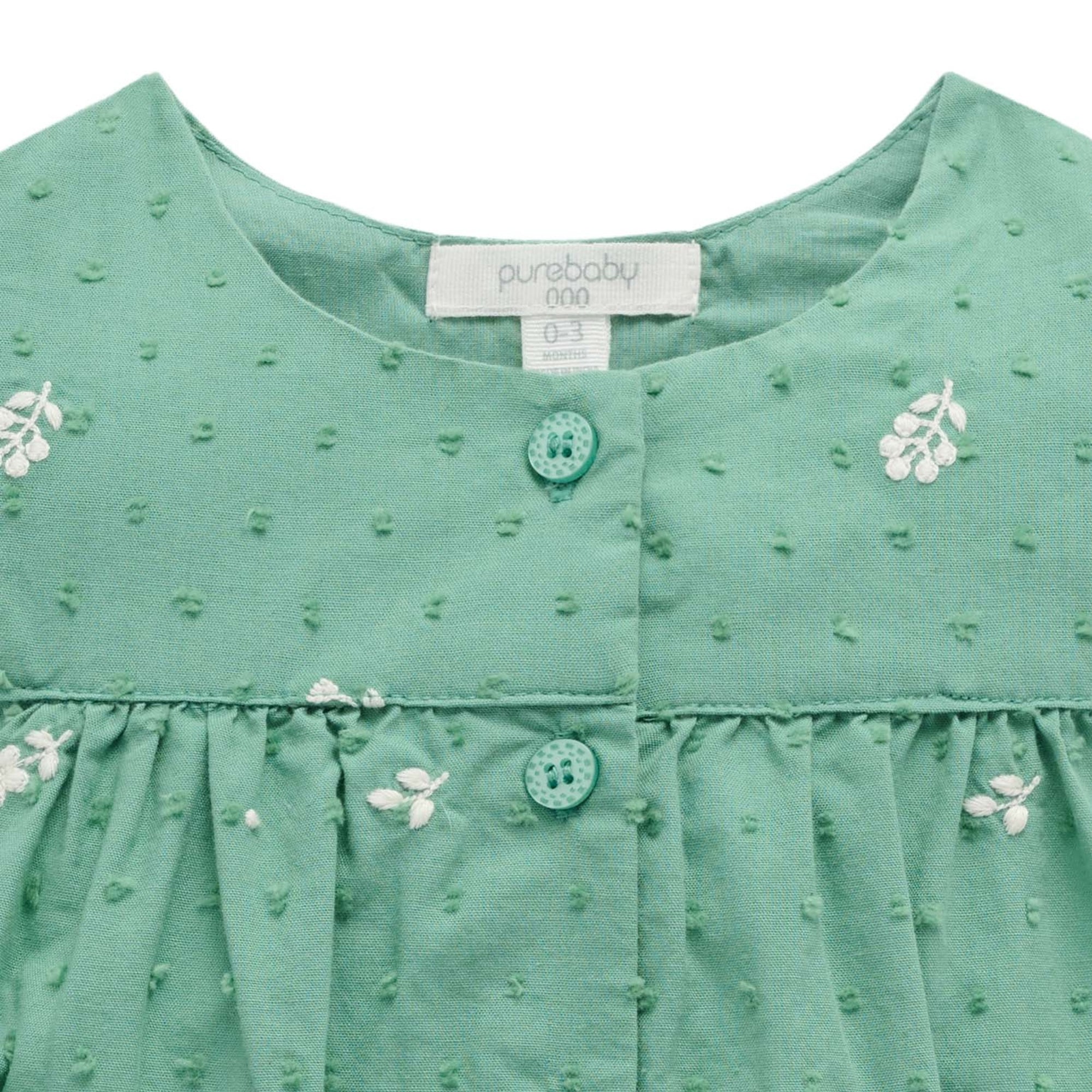 baby wearing purebaby organic festive embroidered bodysuit baby christmas outfit