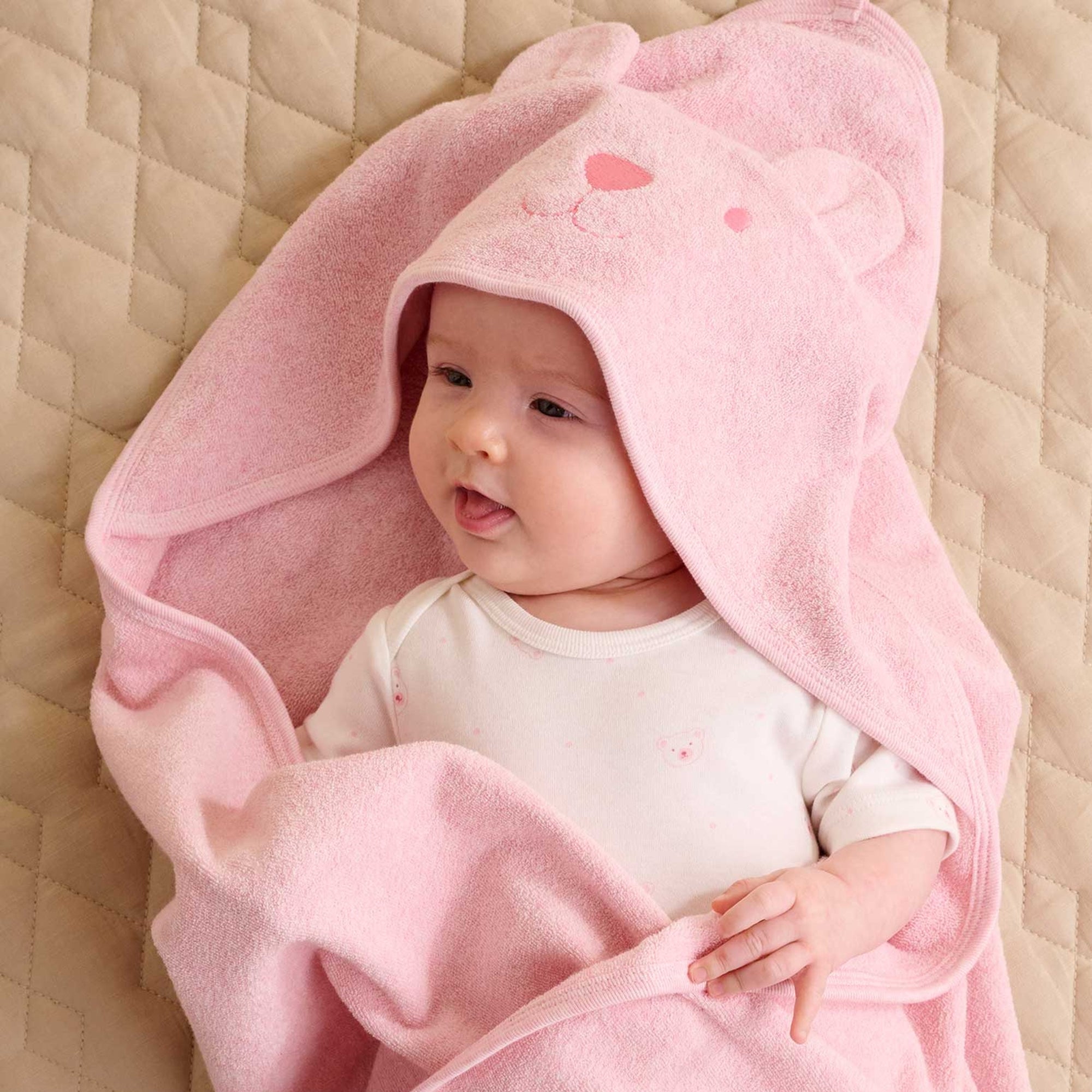 baby wrapped in pink hooded organic cotton towel newborn baby