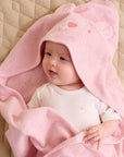baby wrapped in pink hooded organic cotton towel newborn baby