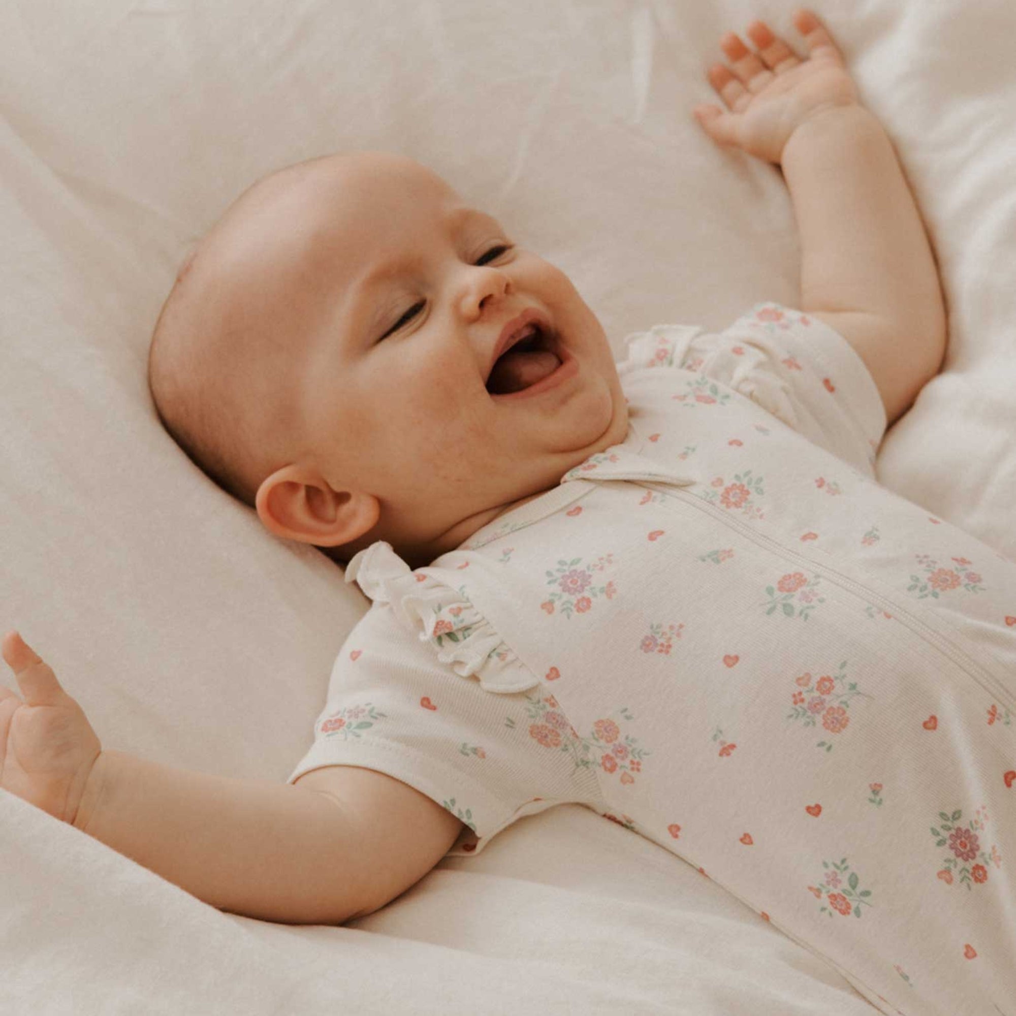 purebaby organic ruffle zip growsuit love heart floral baby