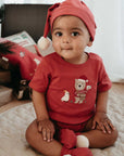 baby in purebaby organic postie santa bodysuit baby christmas outfit